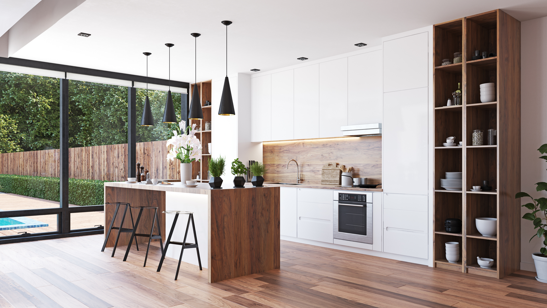 A modern kitchen with white cabinets and wooden floors
