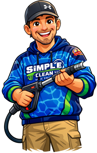 Man in blue hoodie with power washer; smiling, holding equipment.