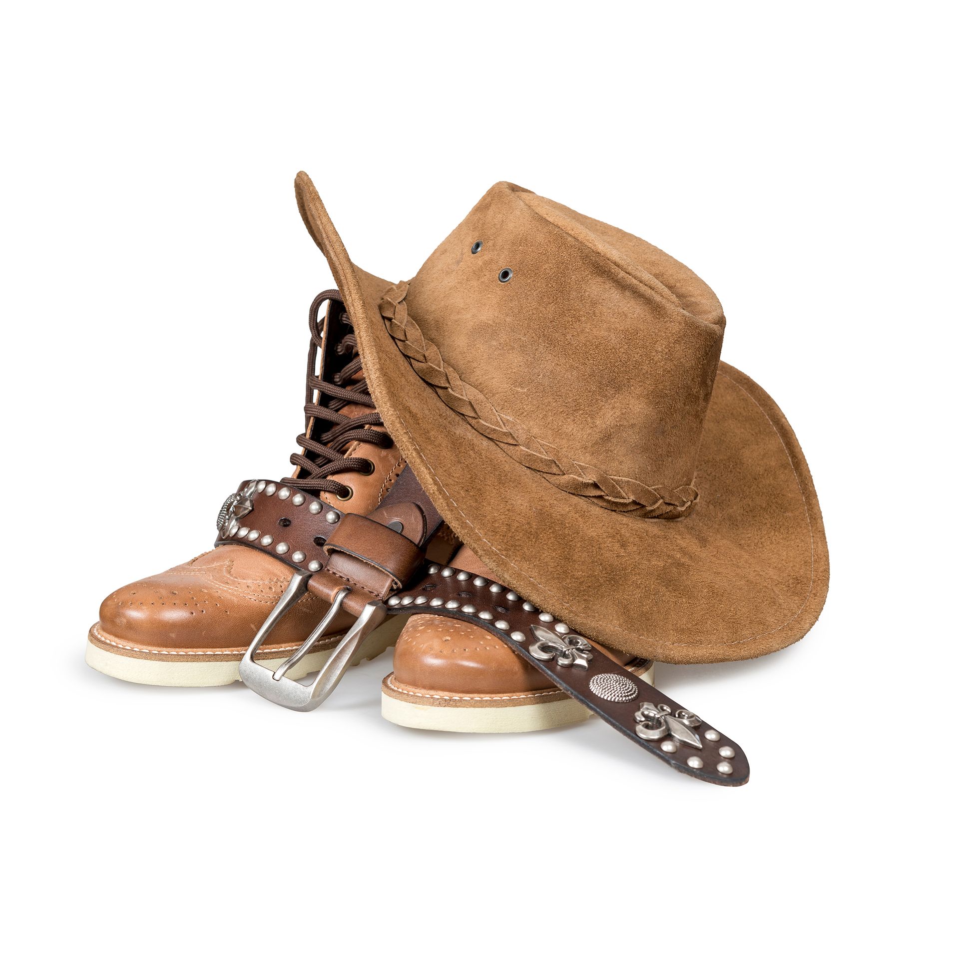 Brown cowboy hat, boots, and studded leather belt on white background.