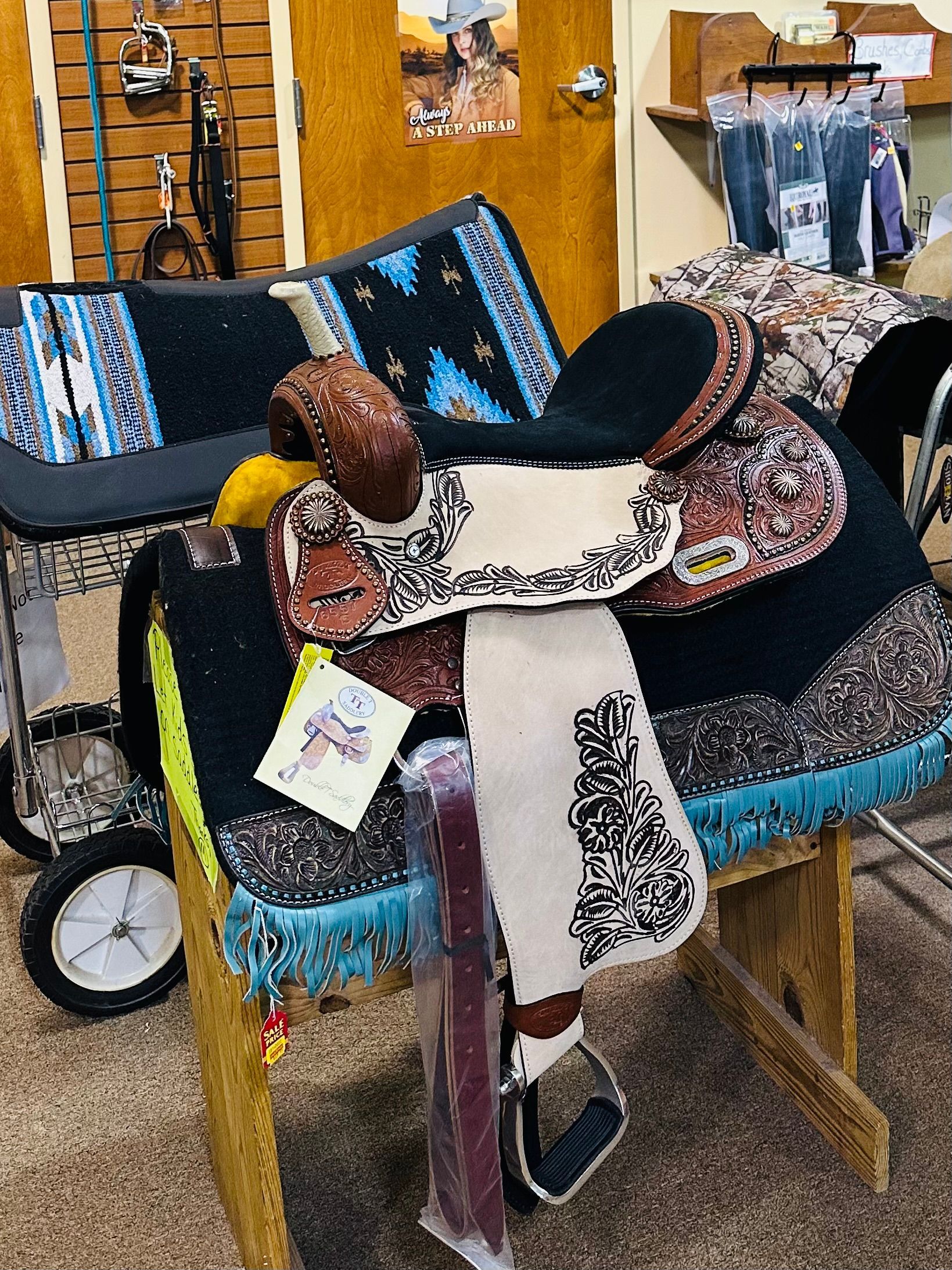 Brown leather crossbody bag with a curved flap and a front pocket.