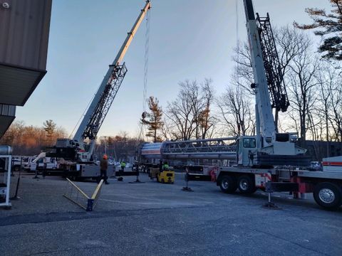 Trucks and Crane Parked Outside — Dover, NH — Moores Crane Rental Corp
