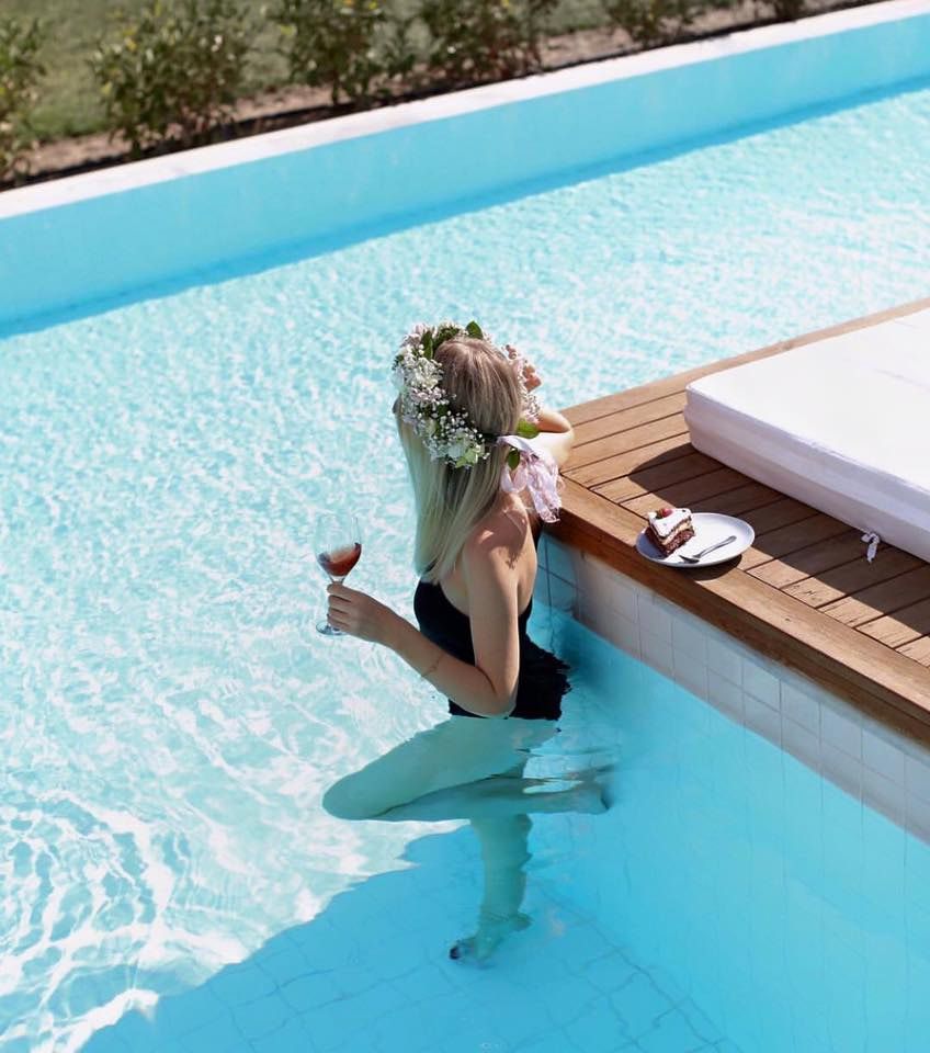 Woman With Flower Crown in a Pool — Creative Pools and Spas in Sorrento, VIC
