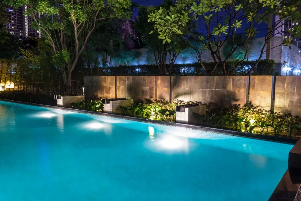 Swimming Pool At Night With Lighting — Creative Pools and Spas in Mornington, VIC