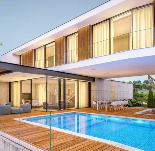 Modern Home with a Large Pool with Wooden Surrounds — Creative Pools and Spas in Melbourne, VIC