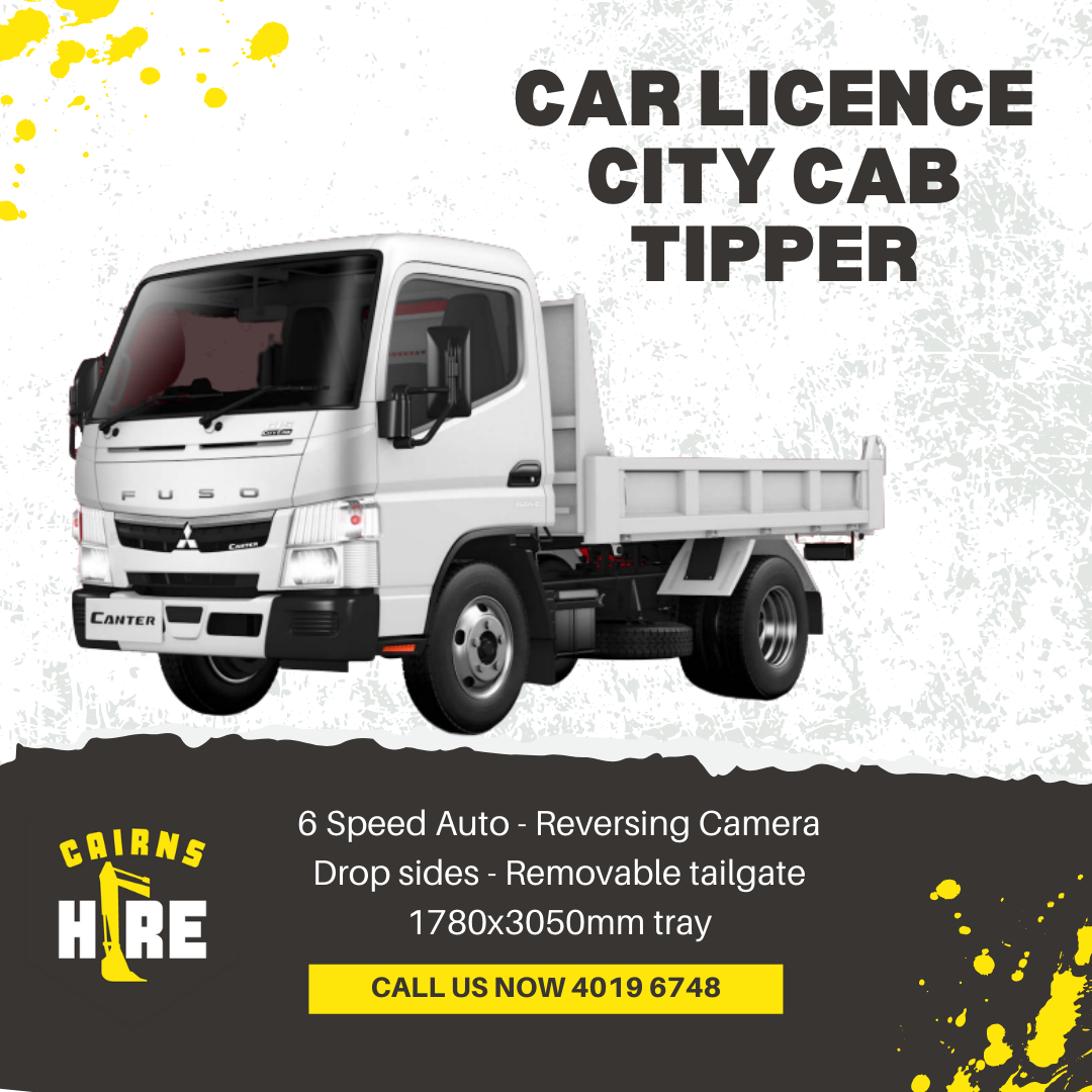 A white truck is sitting on top of a black surface.