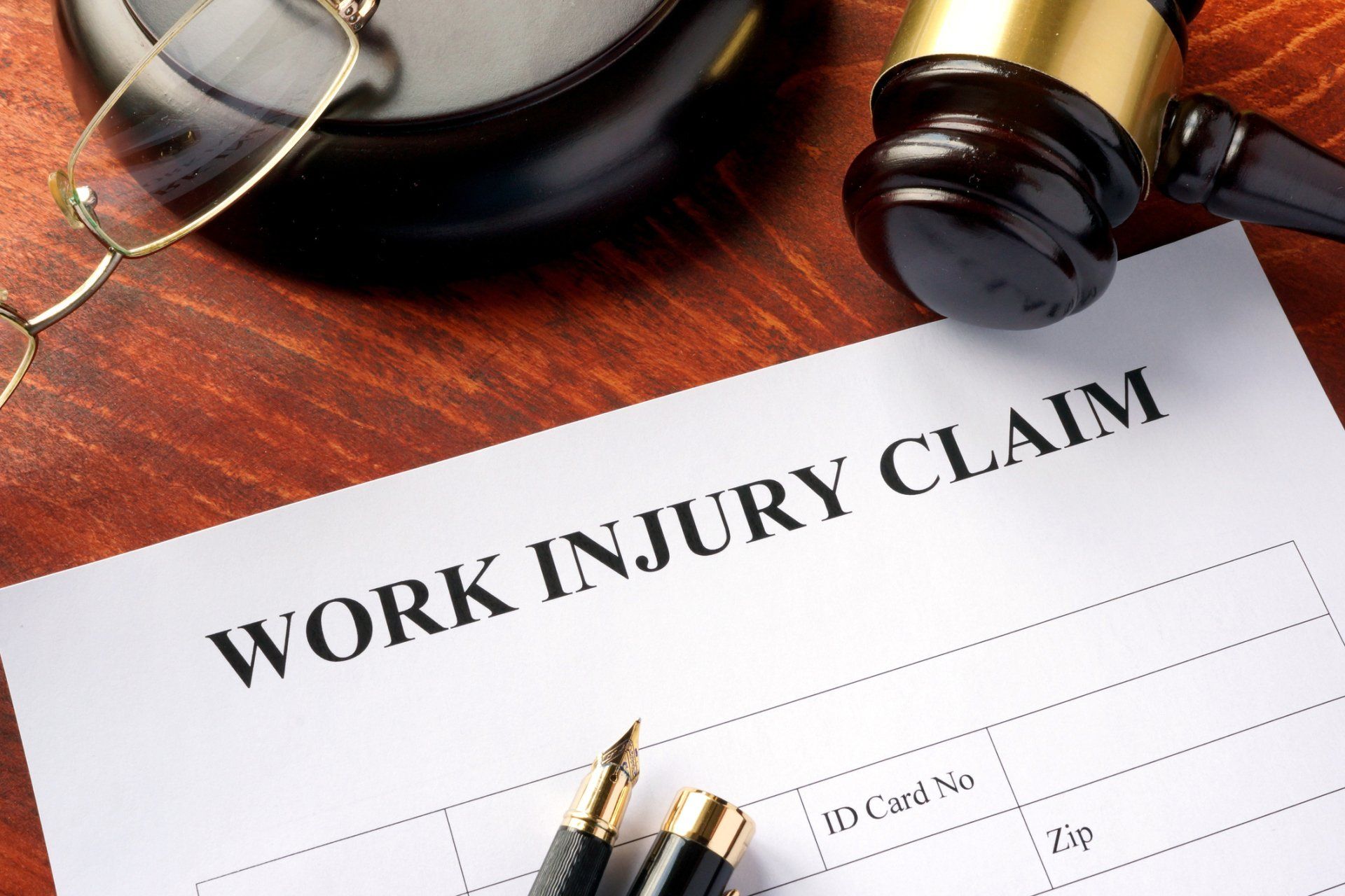 Workers Compensation — Work Injury Claim Form On A Table in Providence, RI