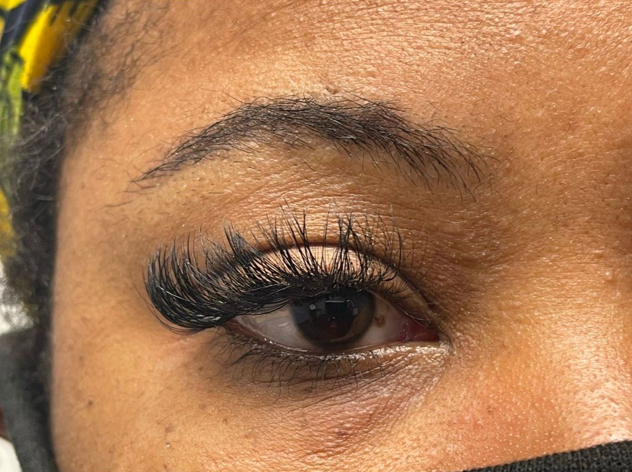 A close up of a woman 's eye with long eyelashes.| St. Louis, MO | Lashing Out Loud