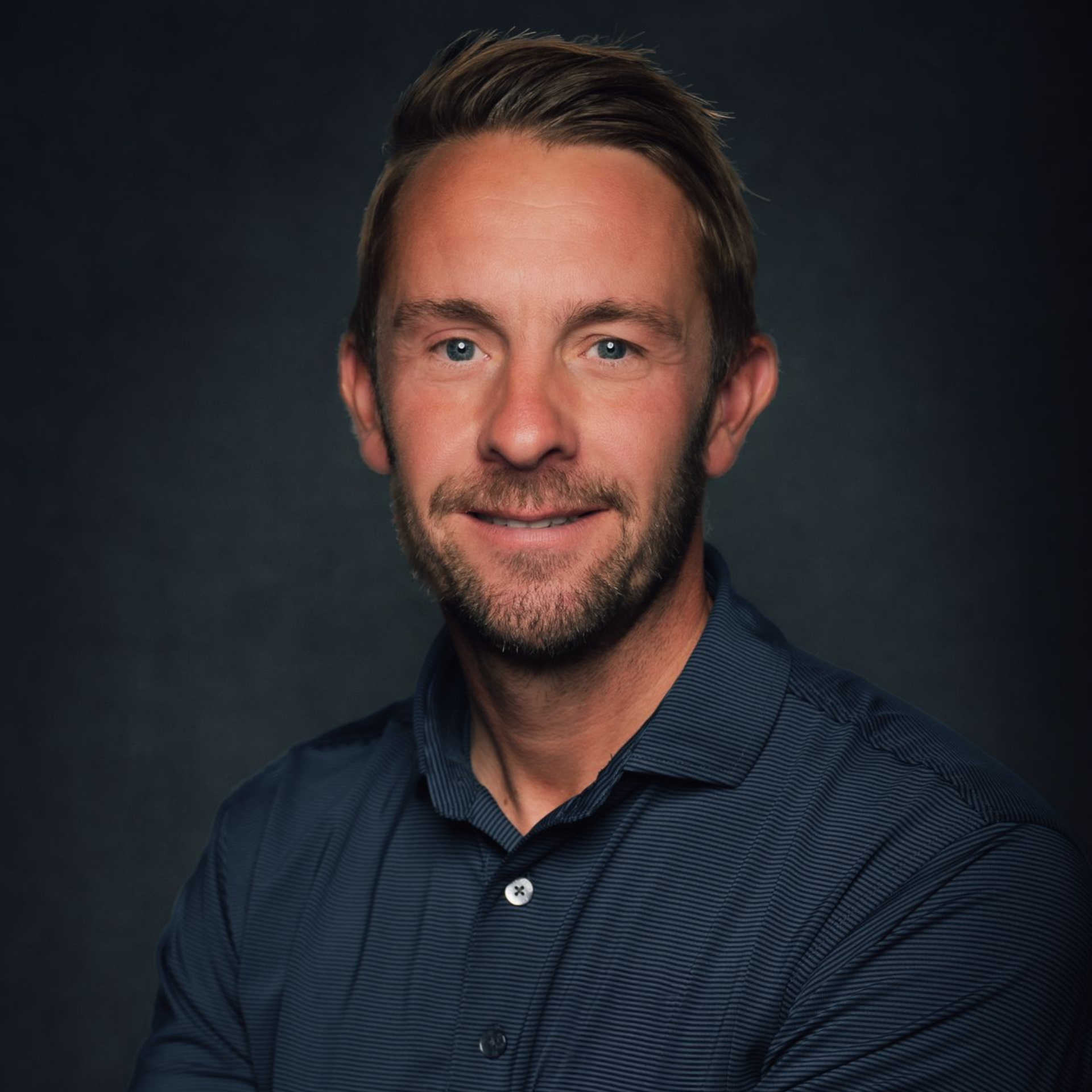 A car is parked on the side of a road in the desert.