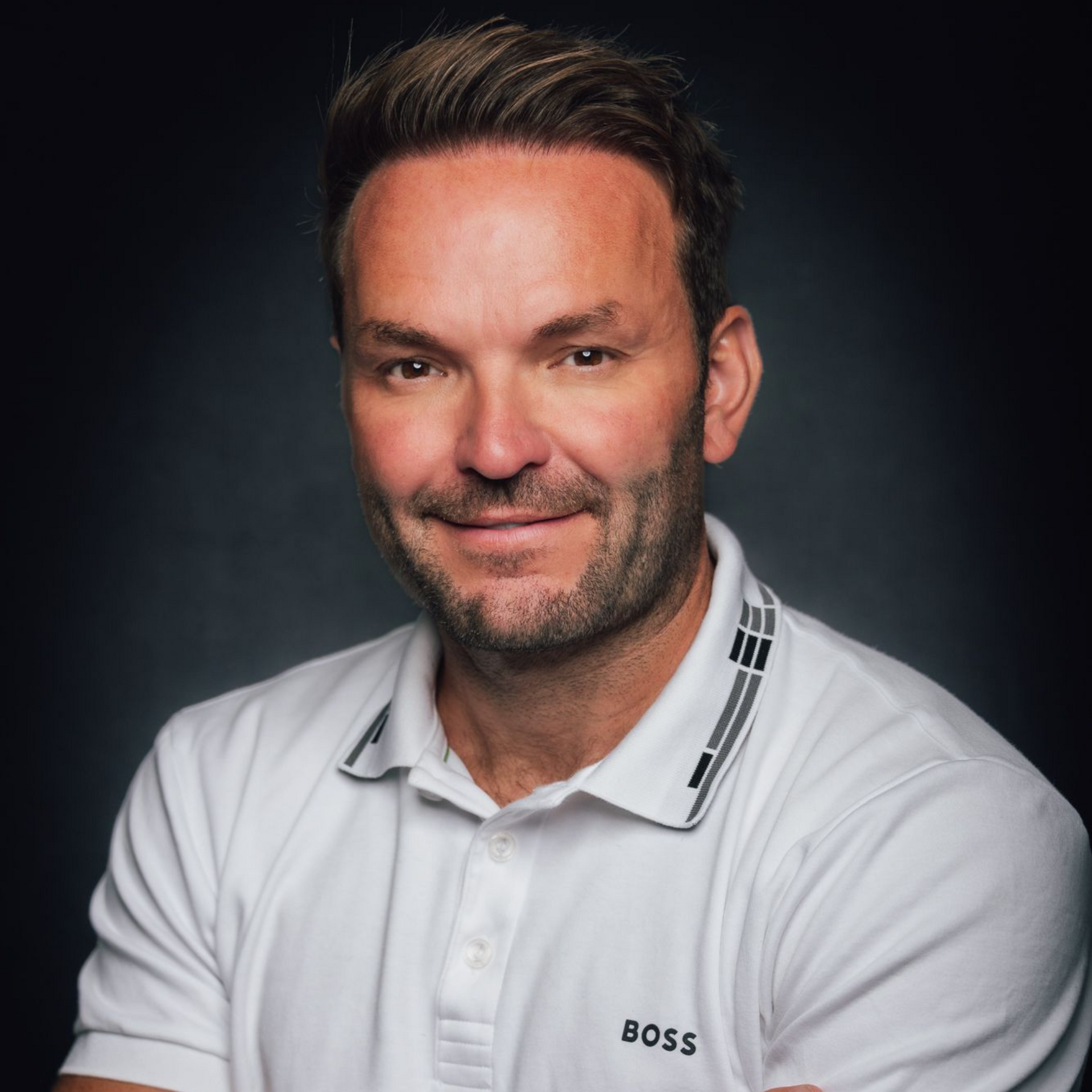 A car is parked on the side of a road in the desert.