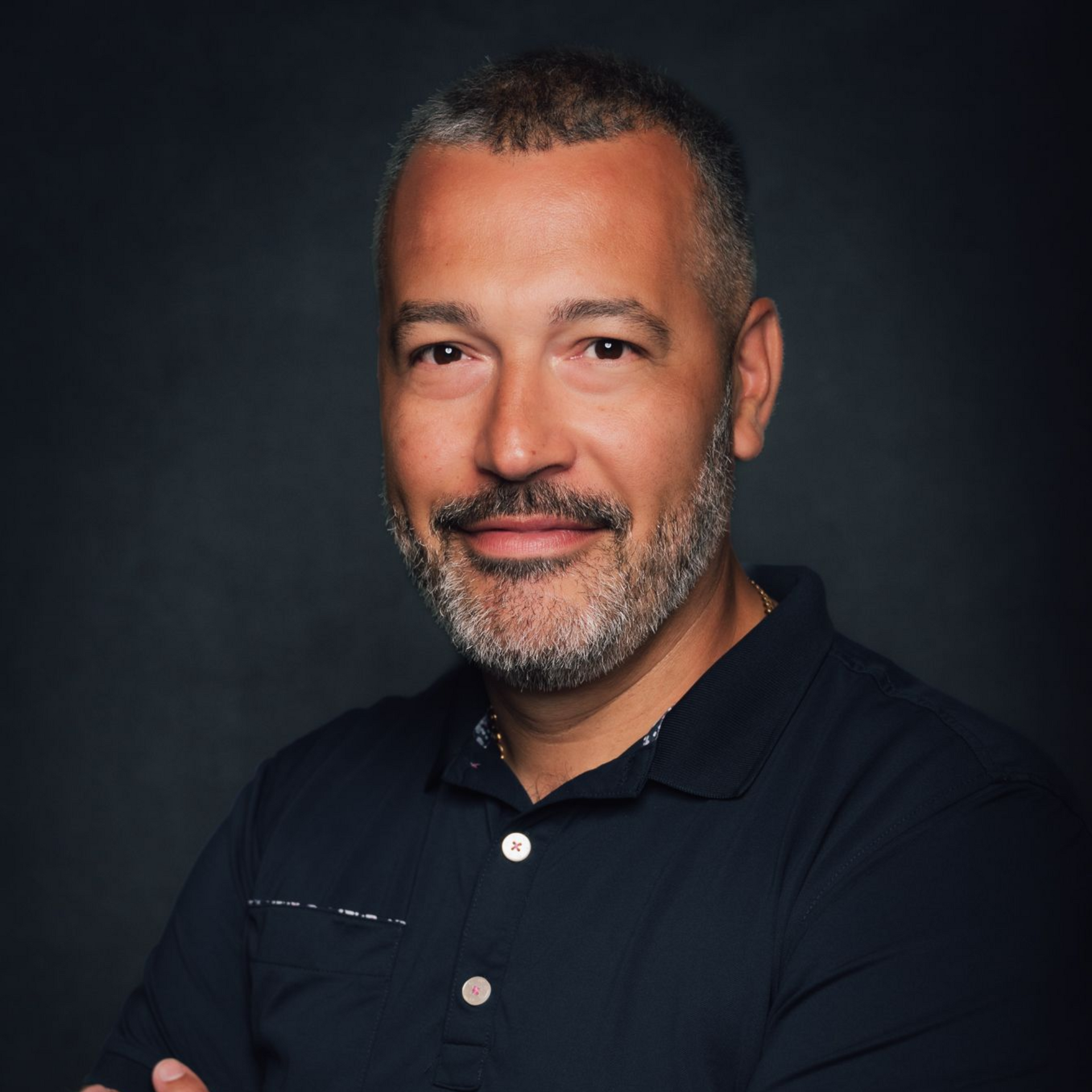 A car is parked on the side of a road in the desert.