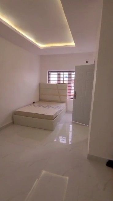 There is a bed in the middle of the room.