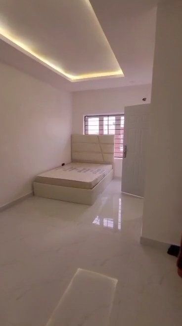There is a bed in the middle of the room.