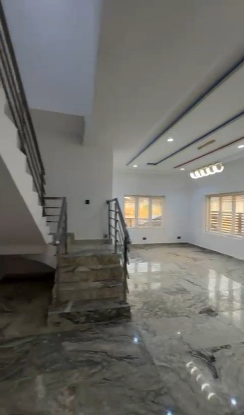 There is a staircase leading up to the second floor of a house.