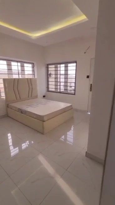 There is a bed in the middle of the room.