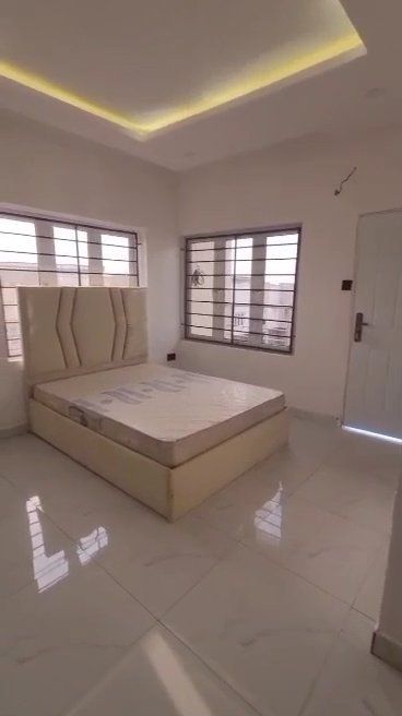 There is a bed in the middle of the room.