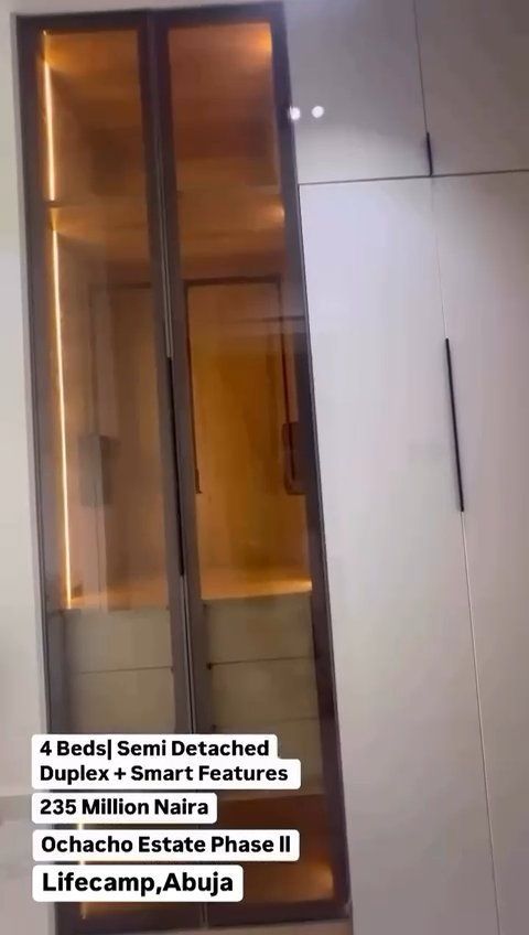 A picture of a wardrobe with a glass door.