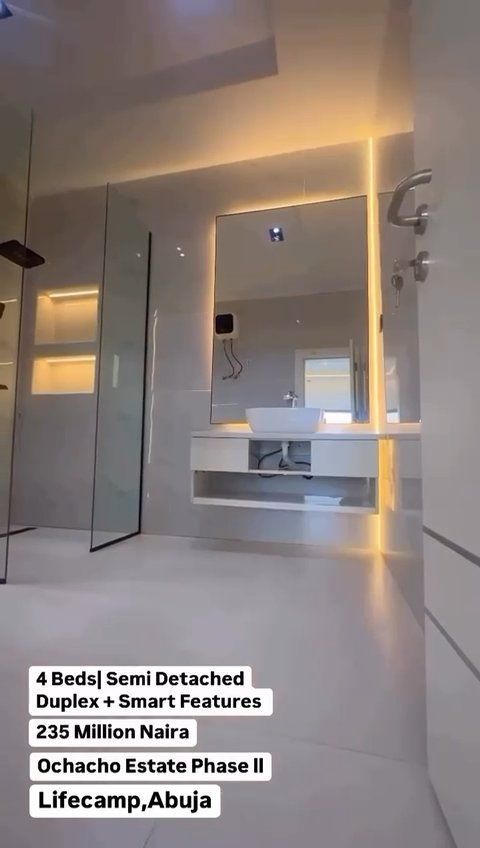 A bathroom with a sink and a large mirror