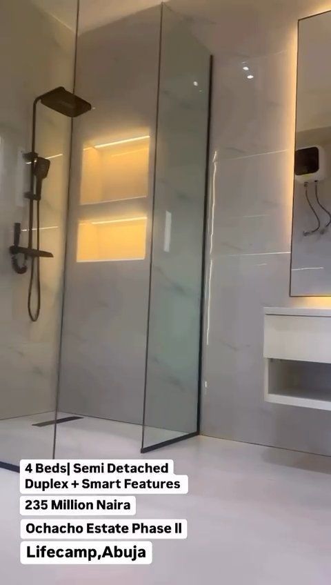 A bathroom with a walk in shower and a sink.