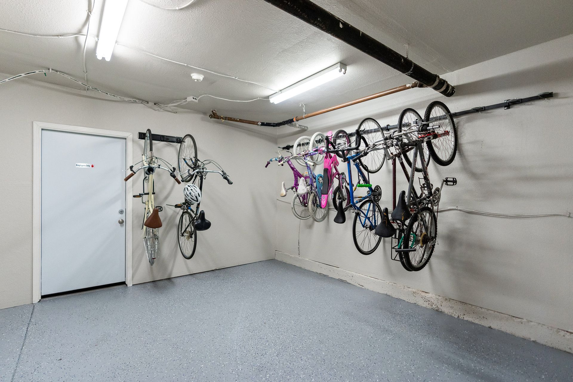 Bathroom with vanity, mirror, toilet, and shower in background.