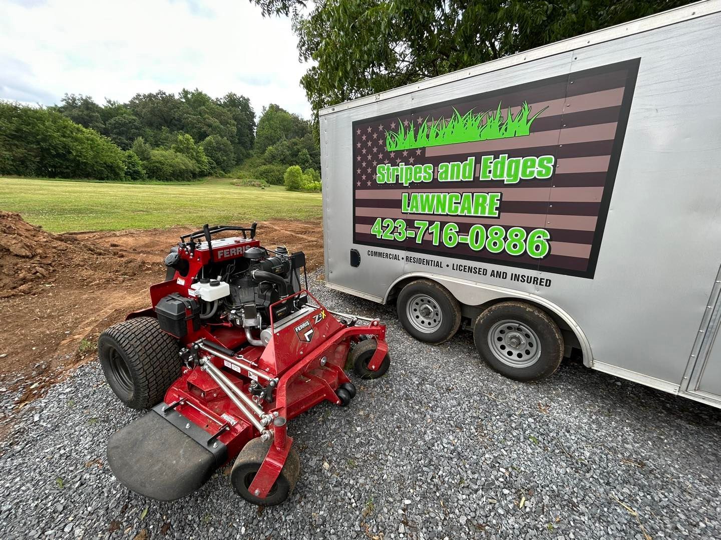 Red lawn mower and trailer with 