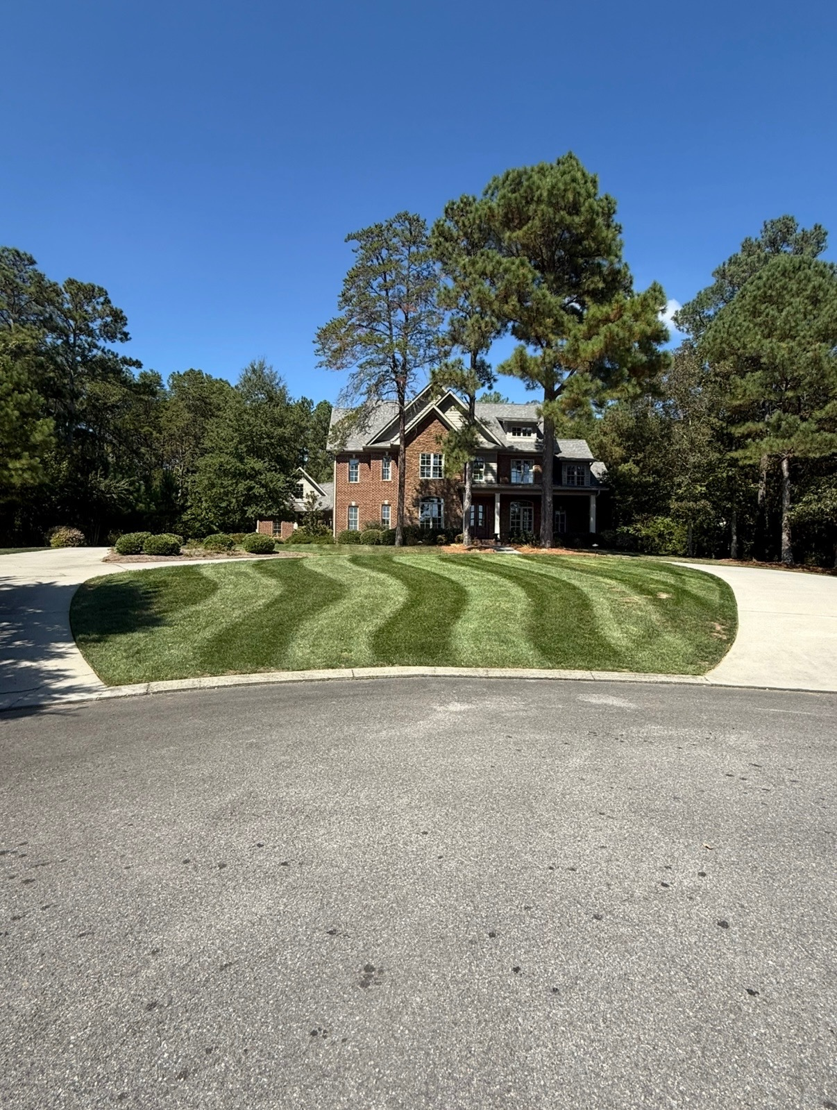 Freshly cut striped lawn by local landscaping company in Cleveland TN