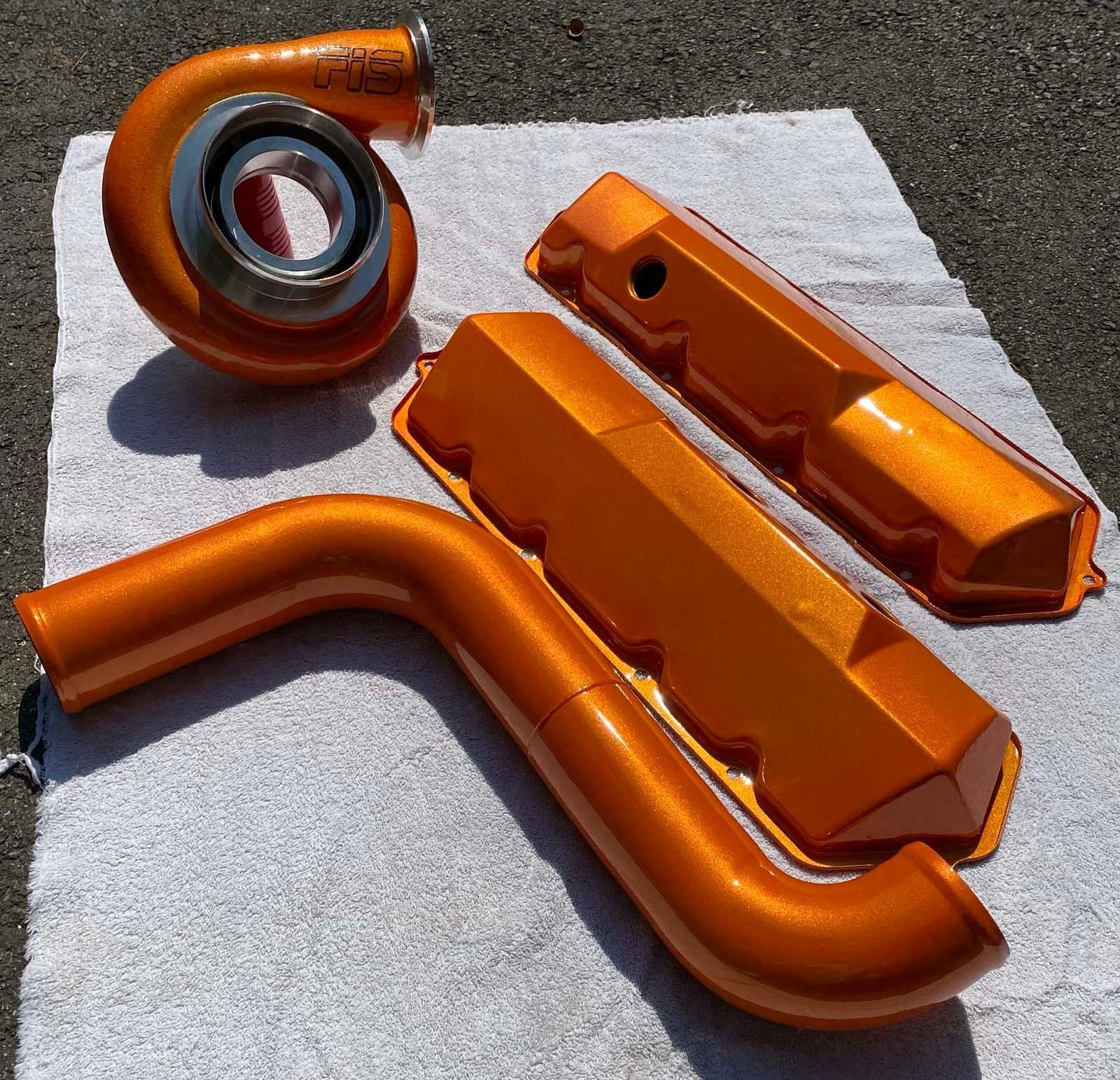 Orange-painted automotive parts.