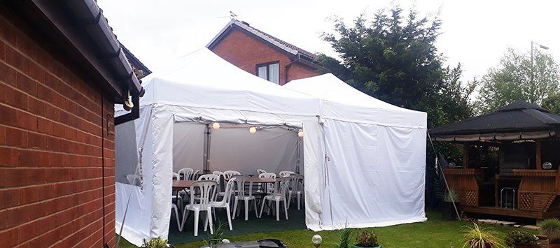 4.5x6m marquee with tables and chairs
