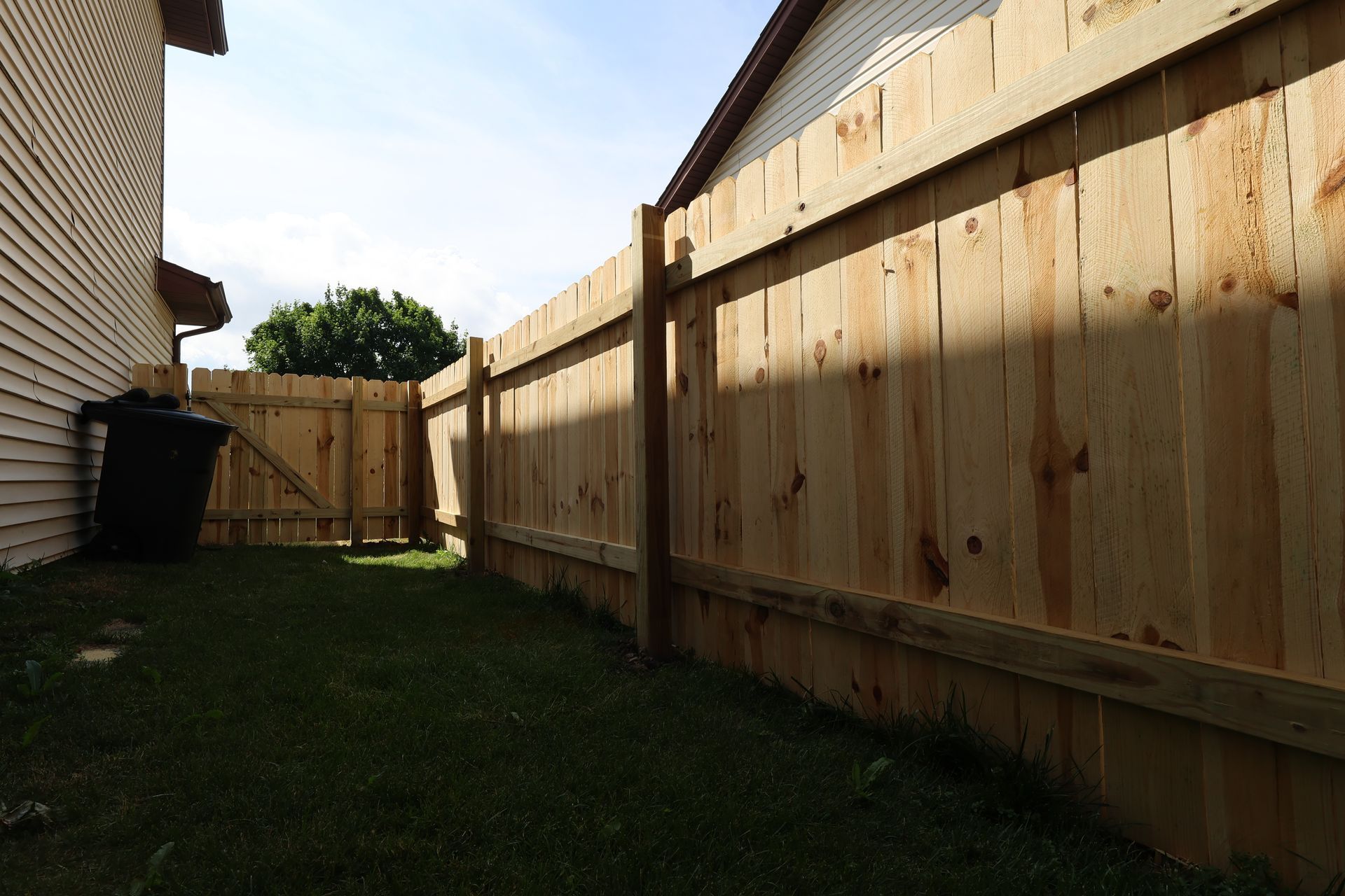 wood fence installation Illinois pressure treated pine shadowbox fencing