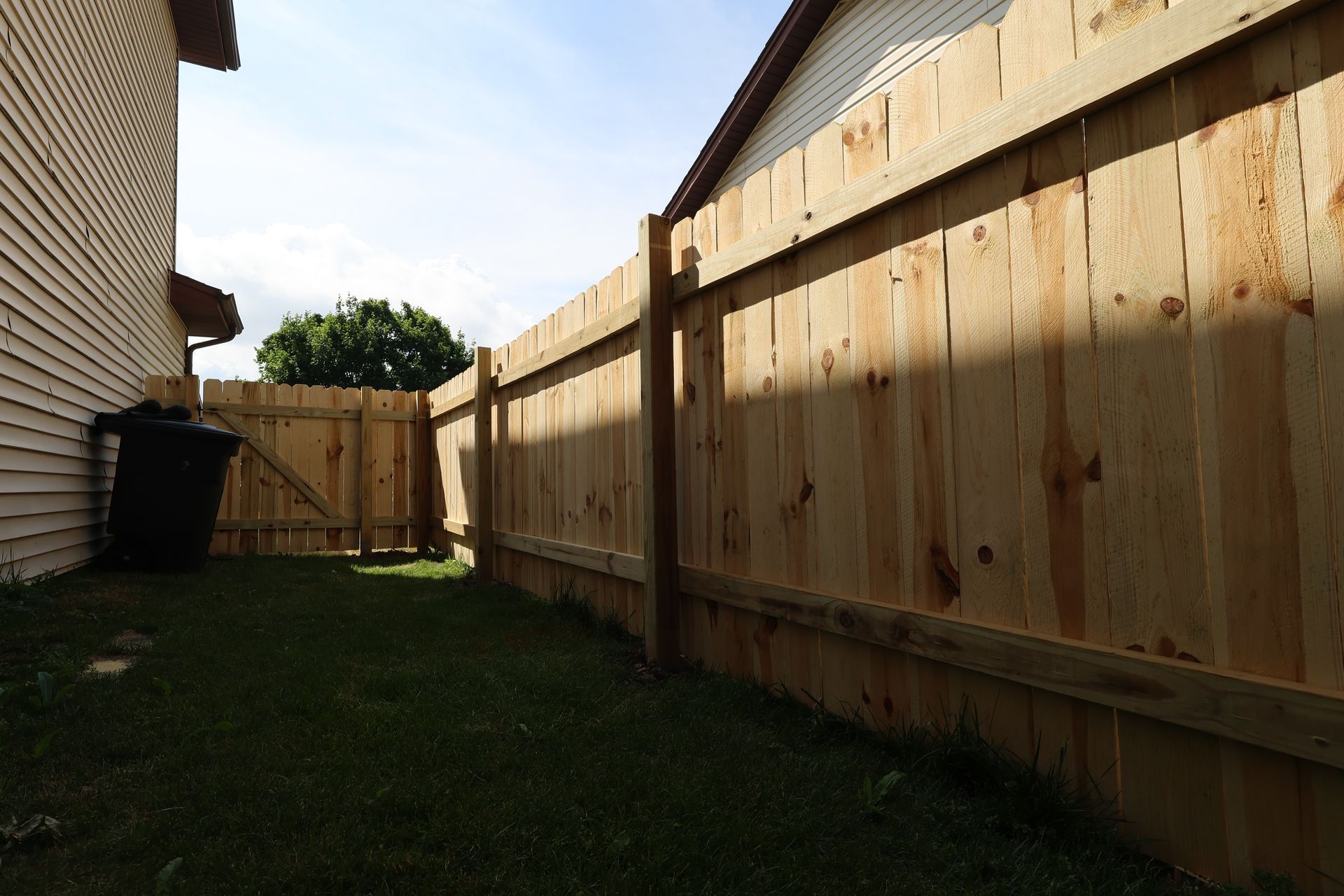 wood fence installation Illinois pressure treated pine shadowbox fencing