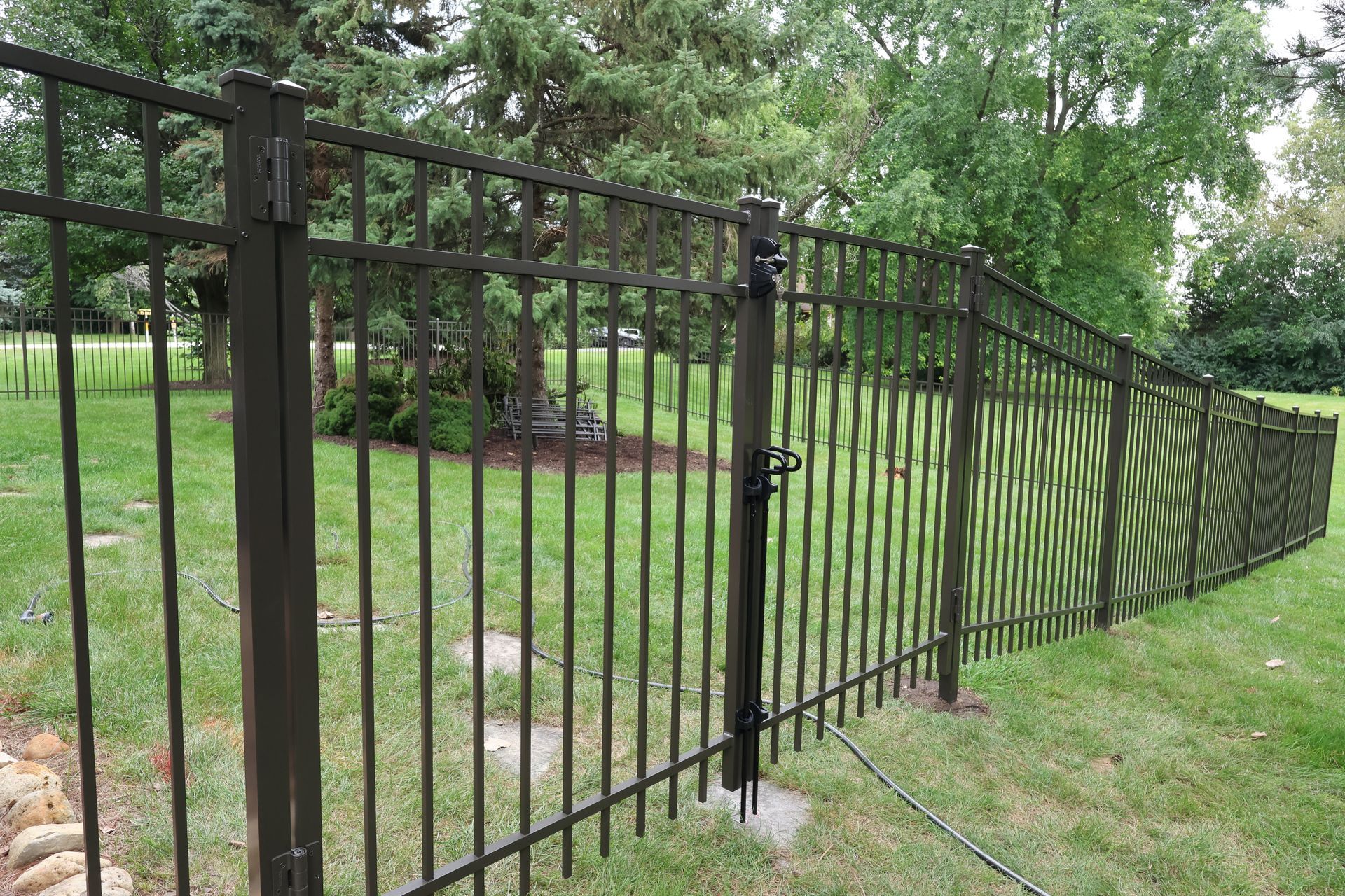 gate gaps under fence uneven ground grade