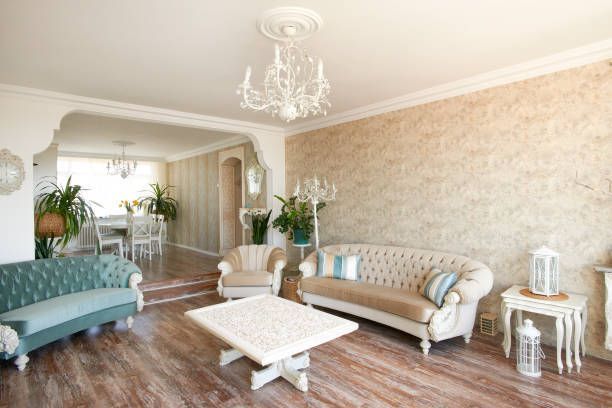 A living room filled with furniture and a chandelier.