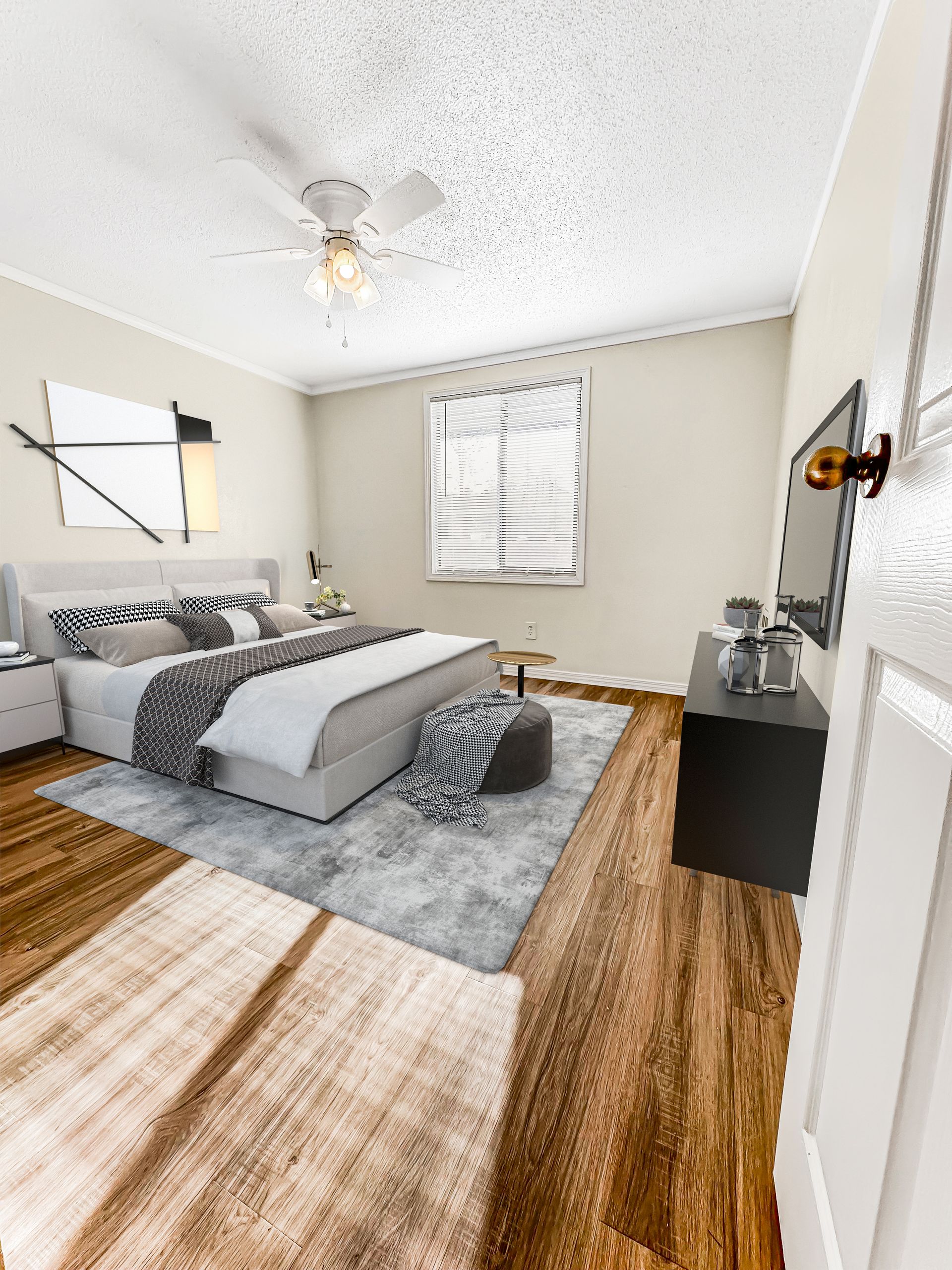 Photo of a bedroom with a bed and still plenty of open space