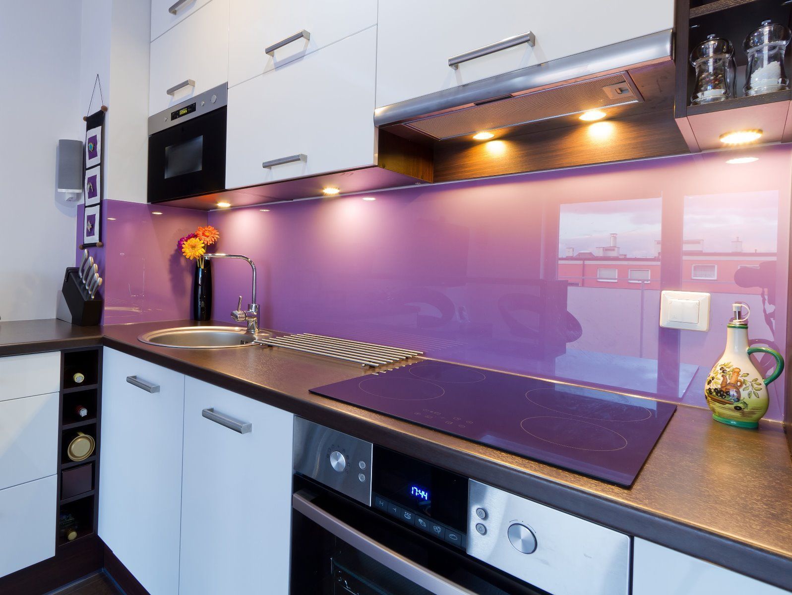 purple glass splashback in modern kitchen