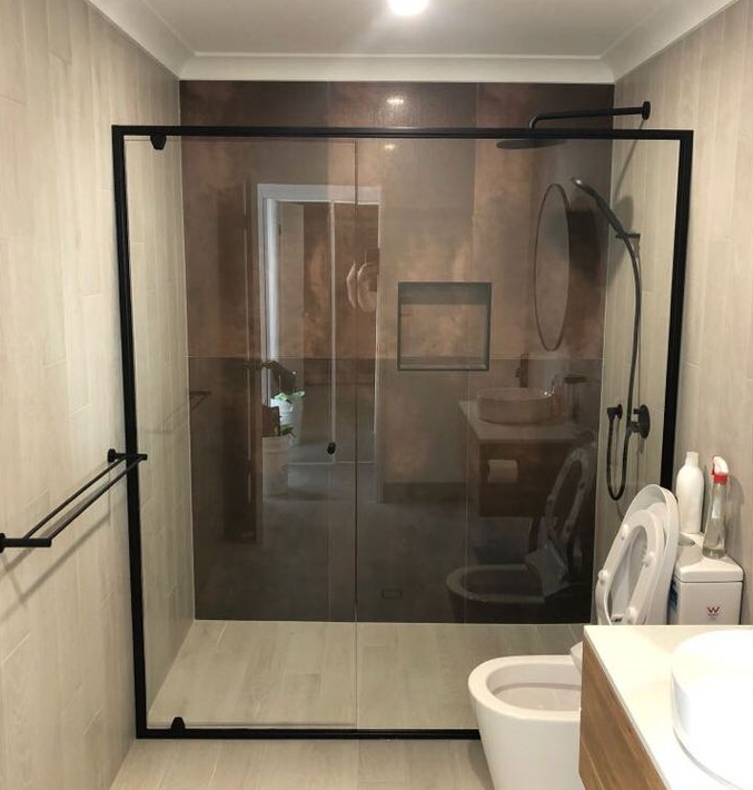 Semi Frameless Pivot Shower Screen With Black Frame — Shower Screens in Coombabah, QLD