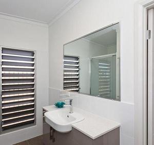Framed mirror in white bathroom Gold Coast