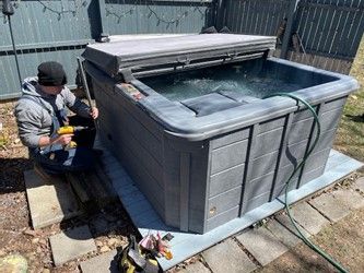 Handyman repairing a hot tub