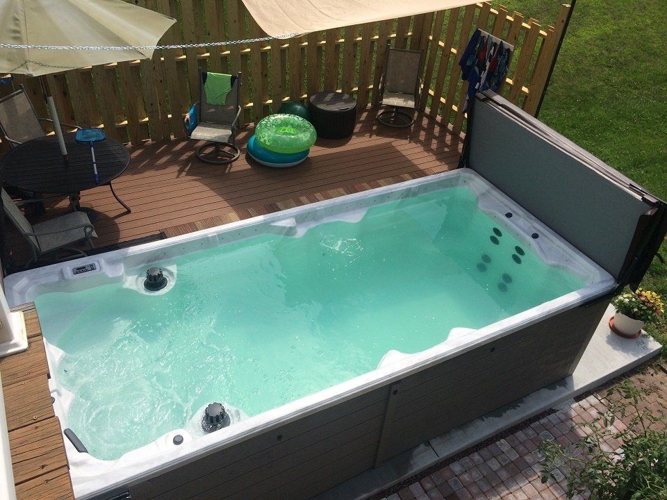 Pennsylvania Swim Spas —  Man Checking Swim Spa in  Mohnton, PA