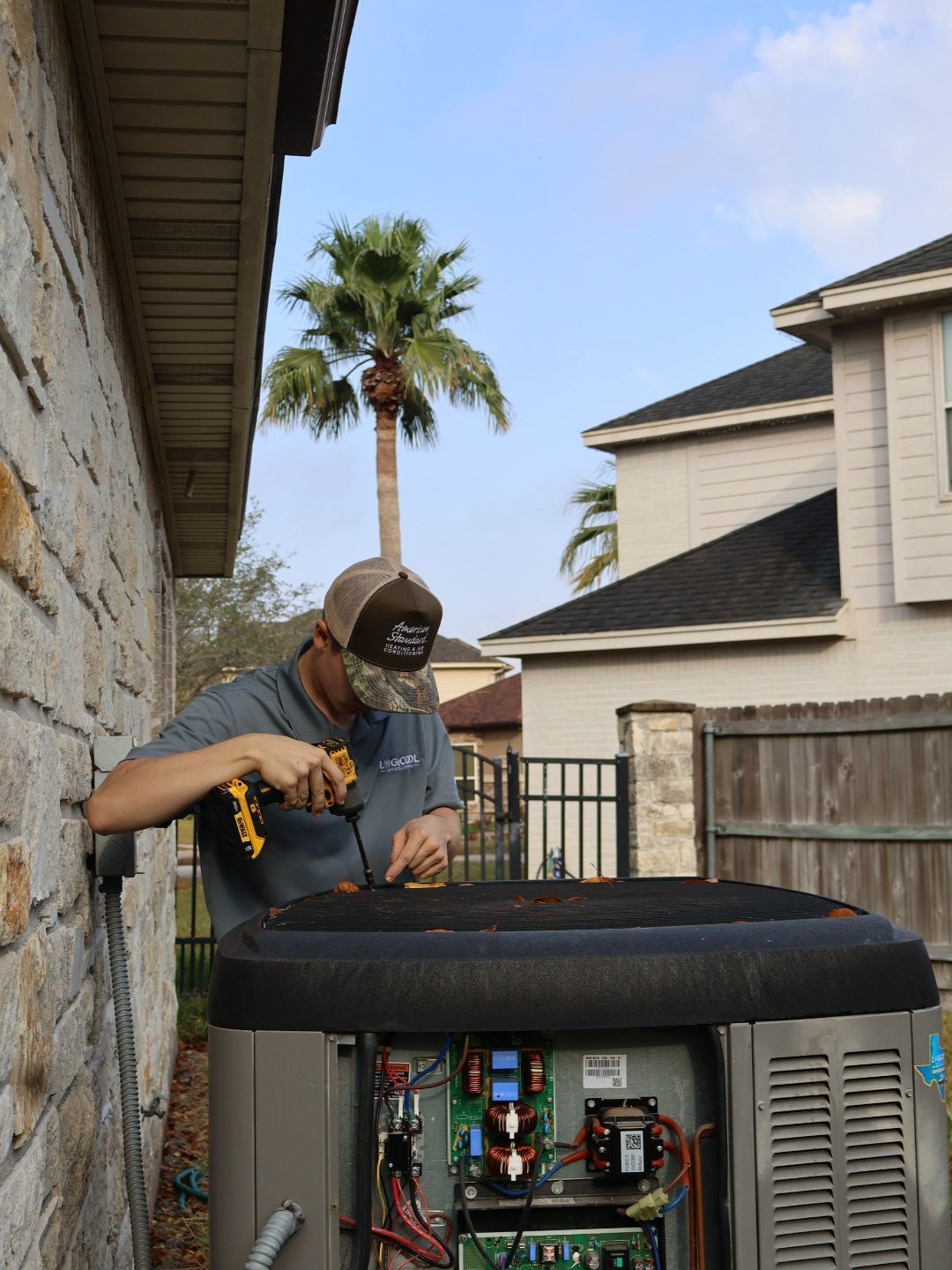 Logicool HVAC technician maintenance on outdoor air conditioning unit in Corpus Christi, Texas.
