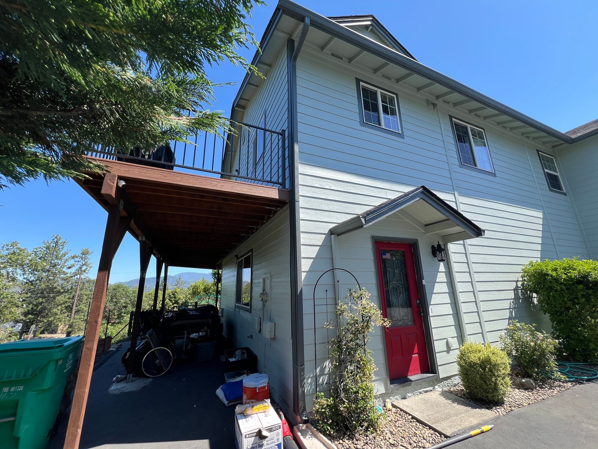 A two story house with new exterior paint and trim in Southern Oregon.