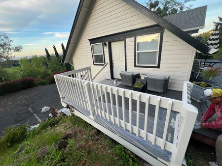 A house in Jacksonville, Oregon has new paint on the deck railing.