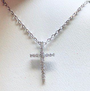 A necklace with a cross pendant on a chain
