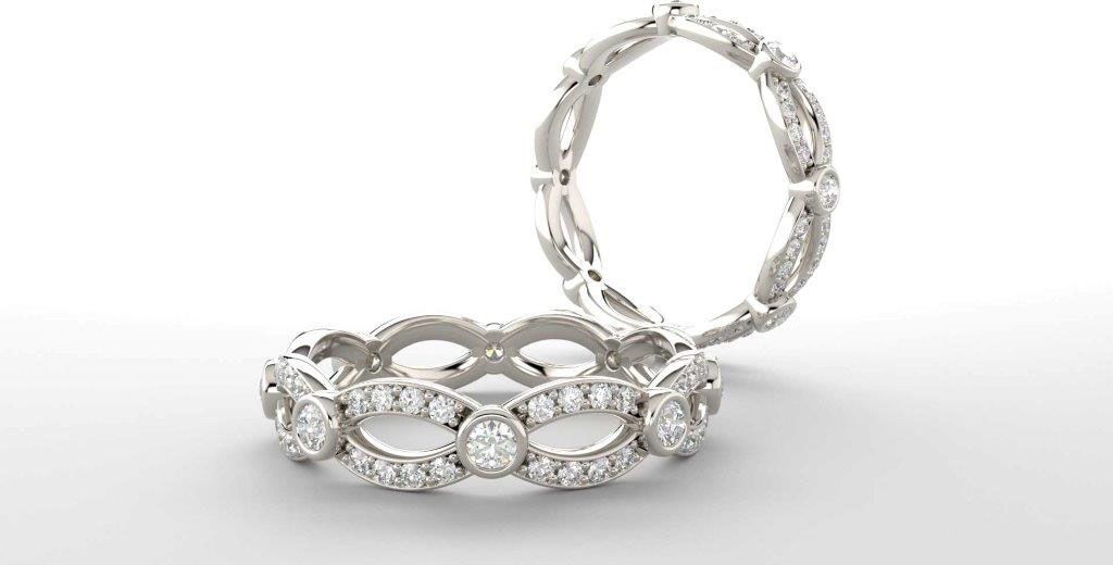 A couple of rings are sitting on top of each other on a white surface.