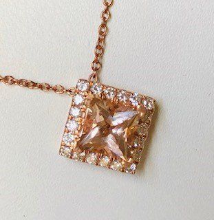 A necklace with a square pendant on a chain