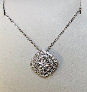 A necklace with a diamond pendant on a chain
