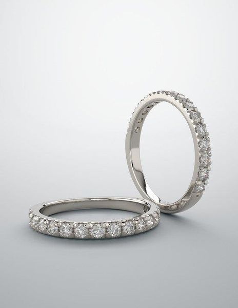 A couple of wedding rings sitting on top of each other