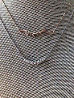 A close up of a necklace on a mannequin.