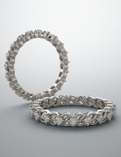 A couple of rings sitting on top of each other on a white surface.