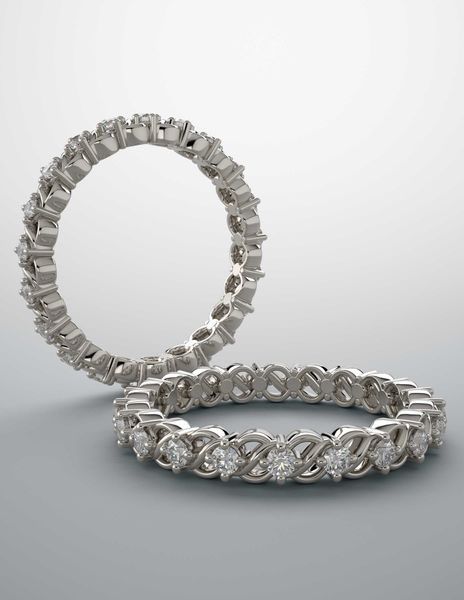 A couple of rings sitting on top of each other on a white surface.