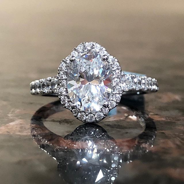 A diamond ring with a large oval diamond in the center