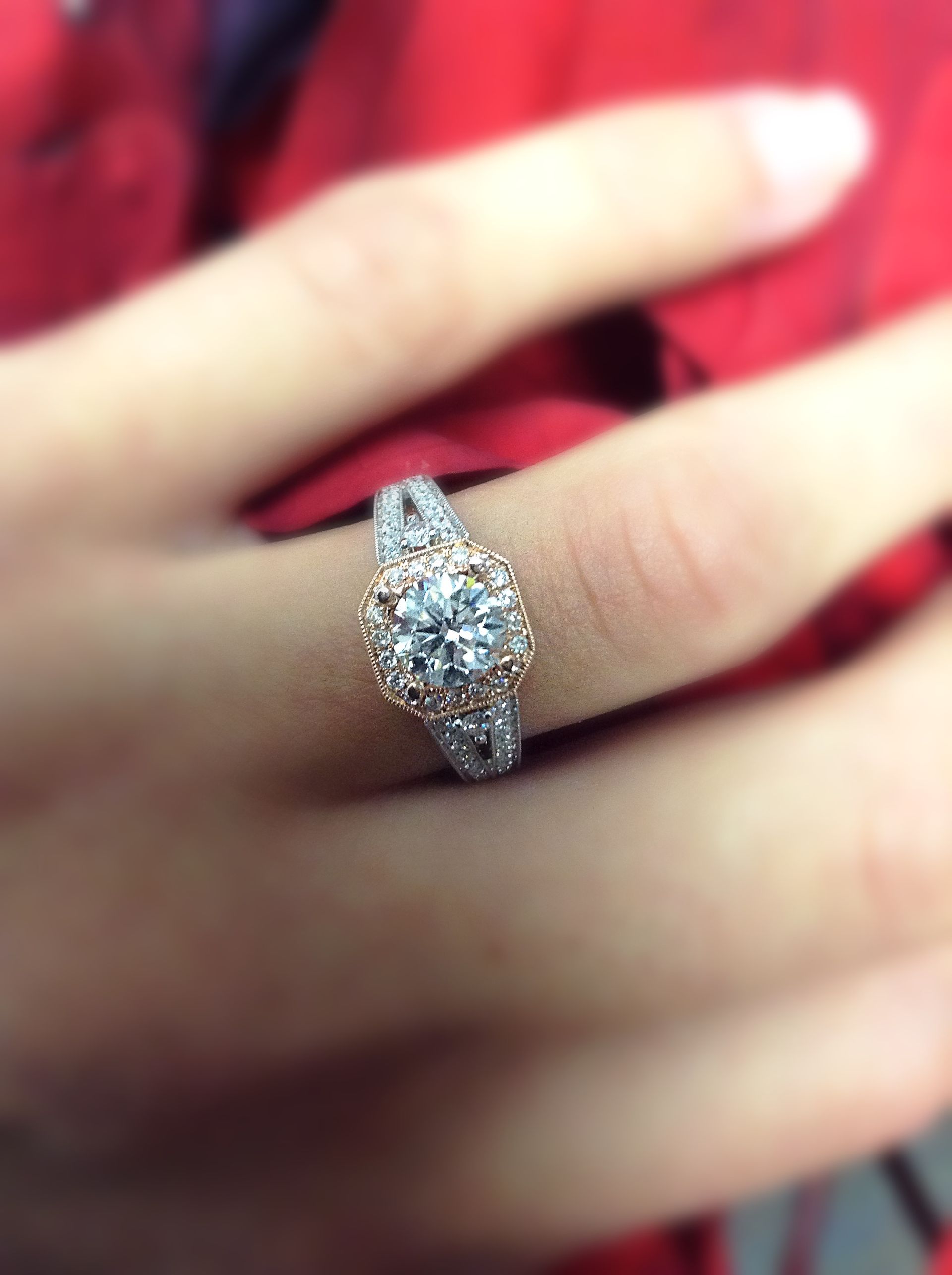 A woman wearing a diamond ring on her left hand